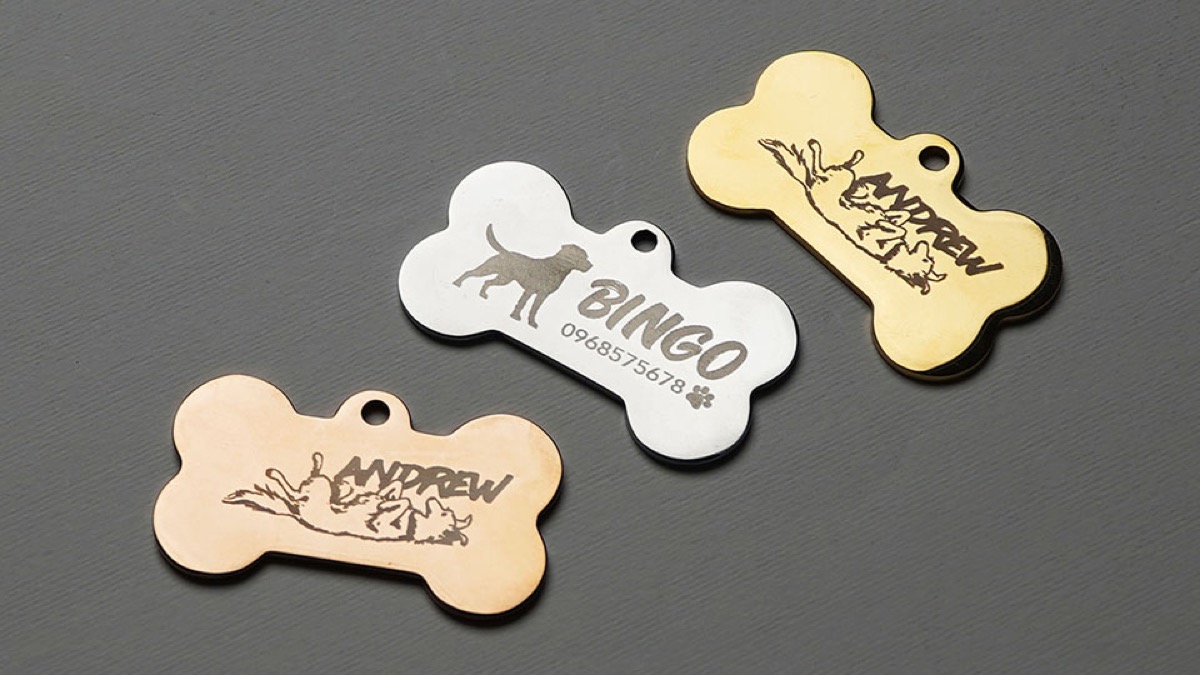 Metal pet tags engraved with names.