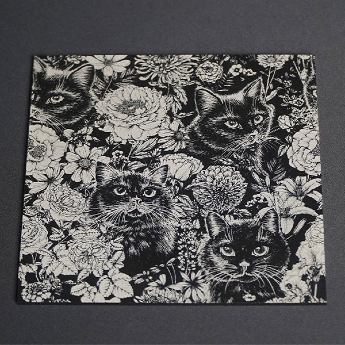 Engraved metal tin with QR code and specs.