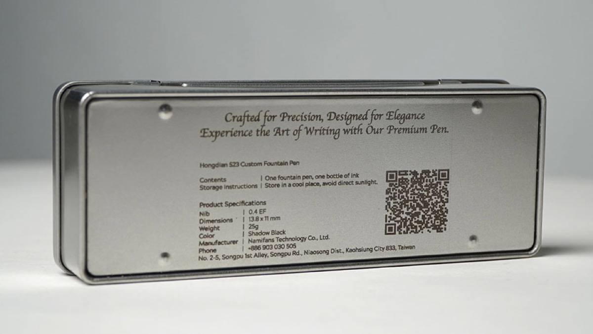 Metal ring engraved with geometric logo.