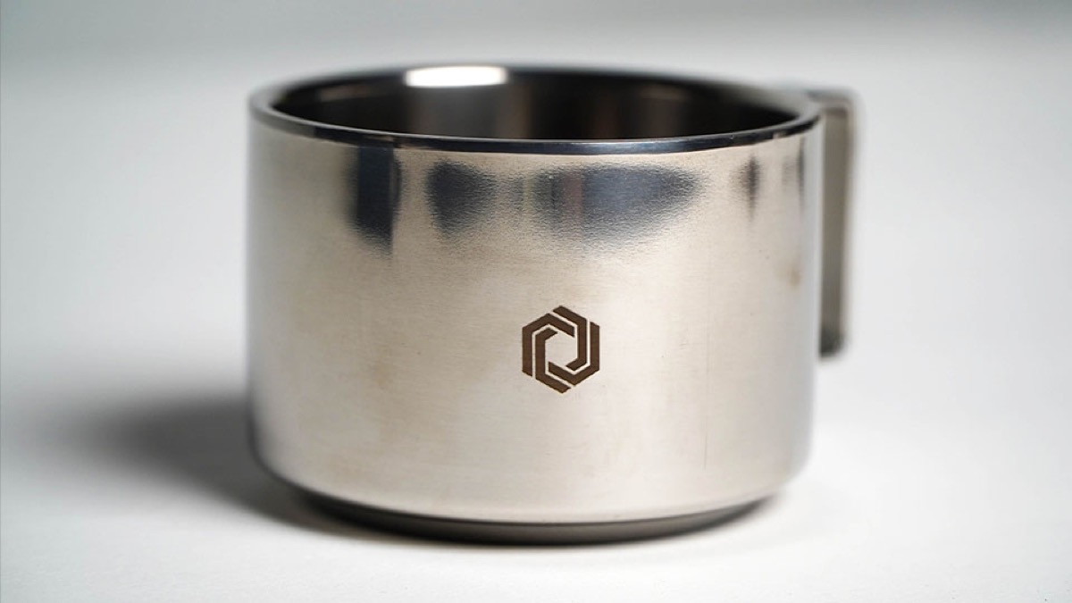 Detailed engraved coin with lion head.